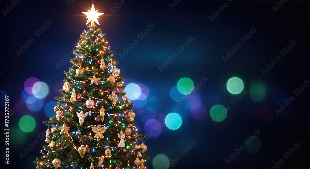 Obraz premium Decorated Christmas tree with glowing lights and ornaments against a dark background. A festive close-up conveys a warm and inviting holiday mood. Holiday cheer, seasonal celebration, winter holidays.