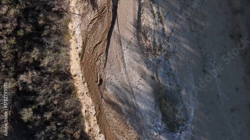 Aerial top down of empty dried up river bed on historic route 66 in Lupton Arizona AZ