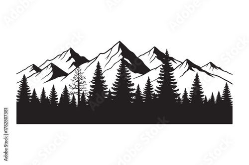 Majestic mountain range silhouetted against a forested landscape