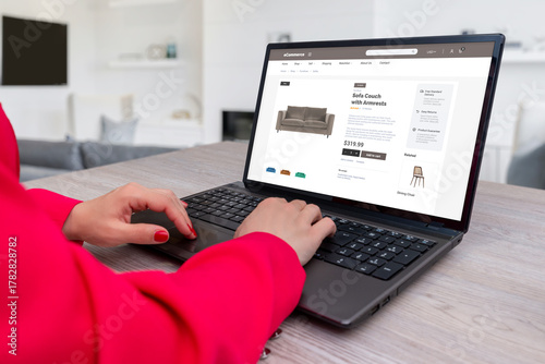 Fotografija Woman browsing online furniture store on laptop, shopping for sofa couch through