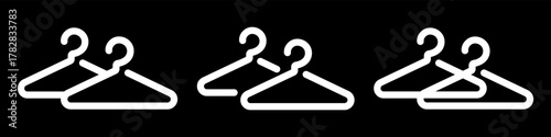 Wardrobe or cloakroom icons with a simple hanger outline on a black background. Modern vector illustration representing dressing area, storage or changing space.
