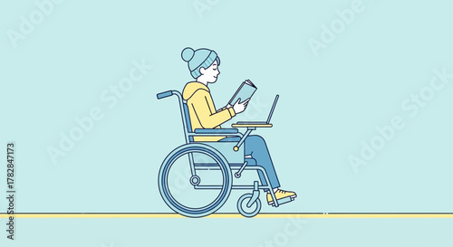 Person in a wheelchair with laptop and book, studying and working