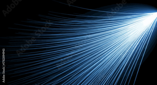 Bright blue light rays illuminating dark background with dynamic energy.