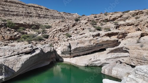 Wadi Bani Khalid is a popular tourist destination in Oman, known for its lush oasis, clear turquoise pools, and rugged mountain scenery.
