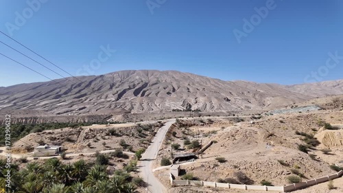 Wadi Bani Khalid is a popular tourist destination in Oman, known for its lush oasis, clear turquoise pools, and rugged mountain scenery.
