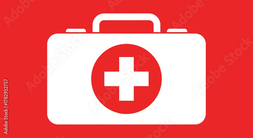 White first aid kit with red cross sits on a red surface, symbolizing emergency medical supplies and healthcare assistance.