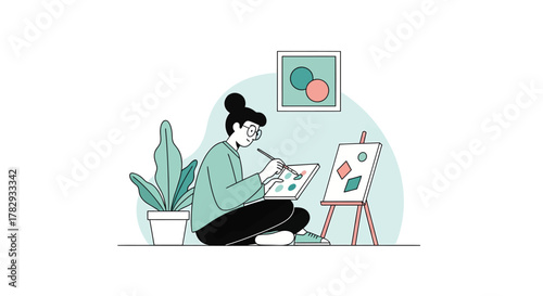 Woman painting abstract shapes on canvas in bright studio with potted plant, creating modern art with focus and creativity.