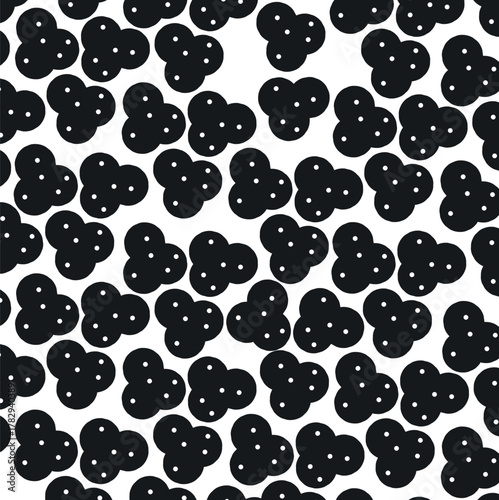 Black spots with three bumps and small holes create texture.