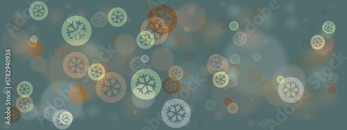 Abstract winter background with blurred bokeh lights and stylized snowflake icons in muted teal and orange tones