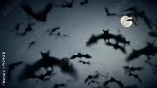 A large flock of bats flying in the night sky under a full moon.