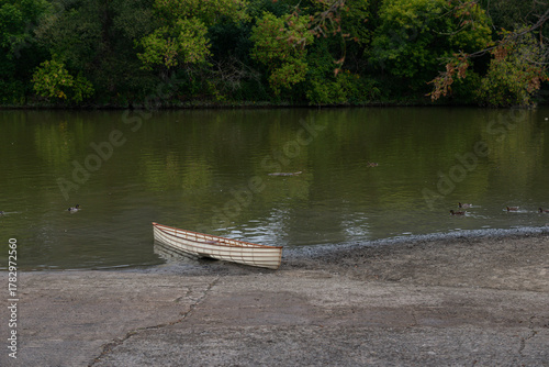 Small boat on river bank