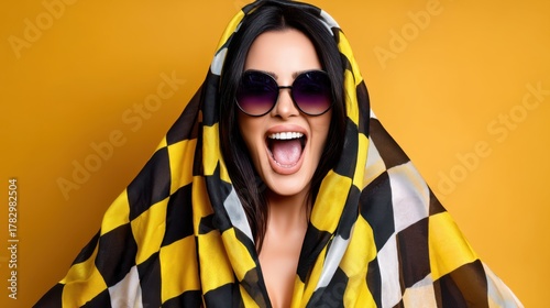Playful studio portrait of woman with expressive face and trendy checkered fashion 