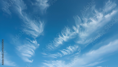 Delicate cirrus clouds in clear blue sky background nature scene tranquil environment