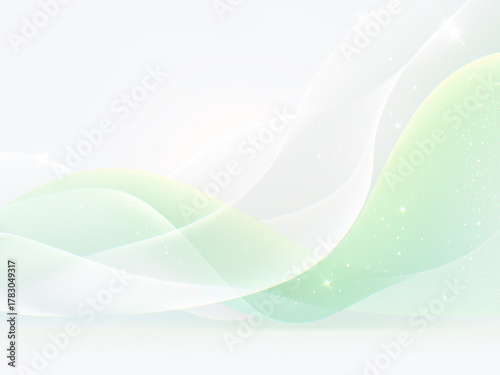 きらめく緑と白の滑らかな波の背景