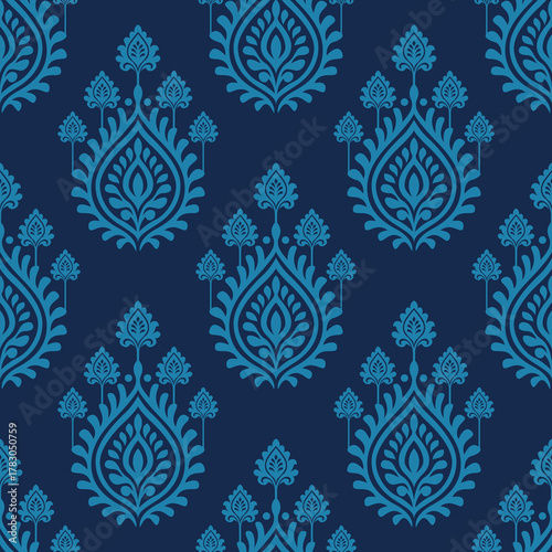 Blue floral damask pattern on dark background with elegant symmetrical leaf motifs creating classic decorative design