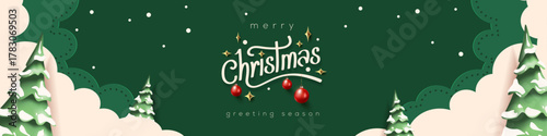 Horizontal green Merry Christmas and Happy New Year greeting card header banner in paper art style with snowy winter landscape snow covered trees for holiday message and festive background