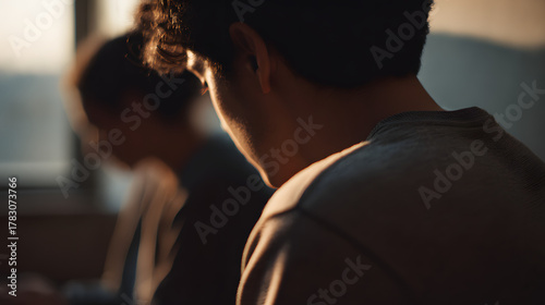 Contemplation and Connection: A poignant portrayal of two individuals engaged in deep thought, bathed in the soft glow of natural light. The scene whispers of introspection, communication.