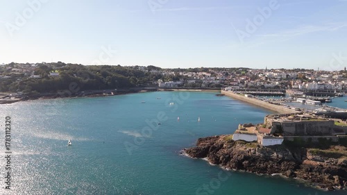Wallpaper Mural 81
High drone footage flying past Castle Cornet into Havelet Bay in late afternoon sunshine on calm day Torontodigital.ca