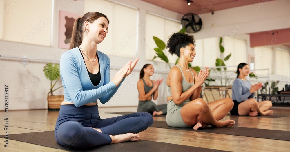 Obraz premium Clapping hands, fitness and women in yoga class for wellness, health or workout together. Happy, applause and group of female people with celebration for achievement with pilates exercise in studio.