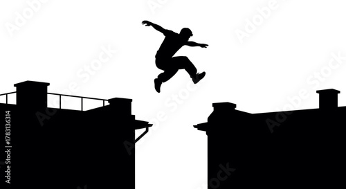 Silhouette of a daring man jumping between rooftops, embodying freedom and adventure, perfect for urban lifestyle and extreme sports themes