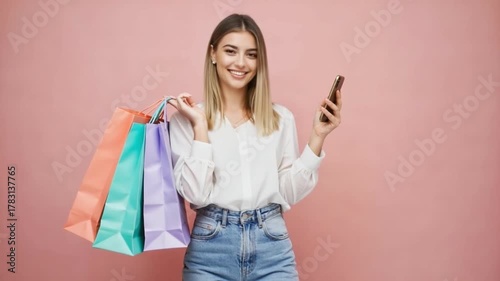 Joyful Shopper's Delight: A radiant woman, her eyes sparkling with delight, holds shopping bags in one hand and a phone in the other, ready to embrace the day.