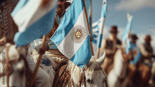 Gauchos proudly waving Argentinian flags on horseback during national Gaucho Day cultural celebration