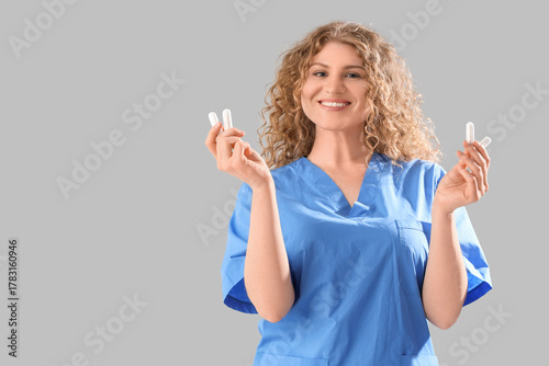 Female doctor with tampons ...