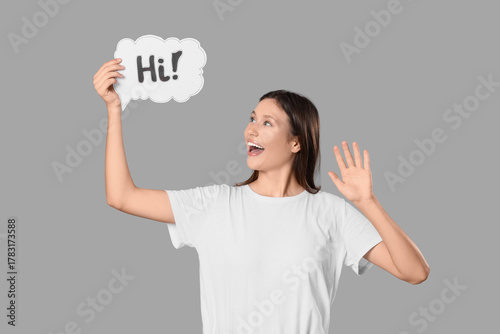 Young woman holding speech ...