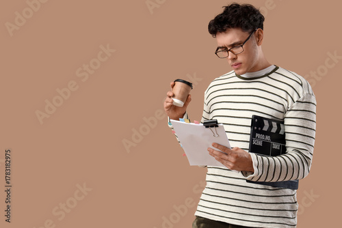 Male screenwriter with coff...