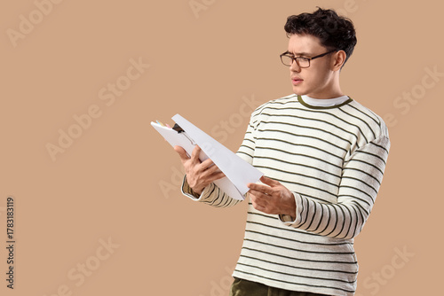 Male screenwriter reading s...