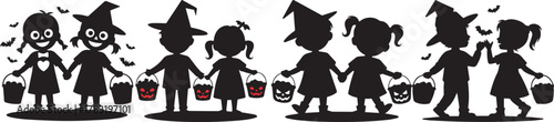 Silhouettes of children in halloween costumes holding hands and candy buckets