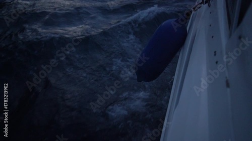 Boat water dark ocean cruising nighttime voyage on choppy waves