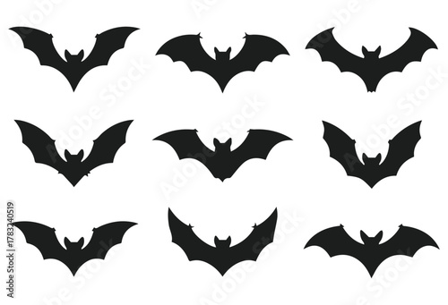 vector set of flying bat silhouettes in black