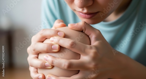 Person Concentrating on Saving Money in a Piggy Bank.