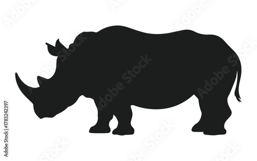 vector silhouette of rhinoceros grazing side view