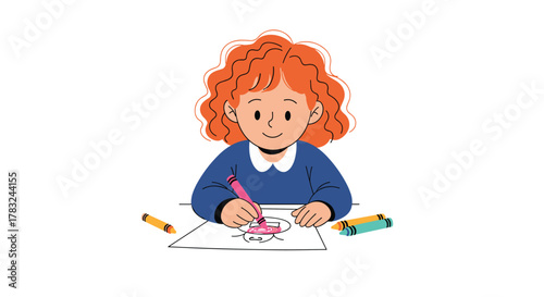 A cheerful young girl with red curly hair smiles as she enjoys drawing and coloring with a pink crayon on a white paper.