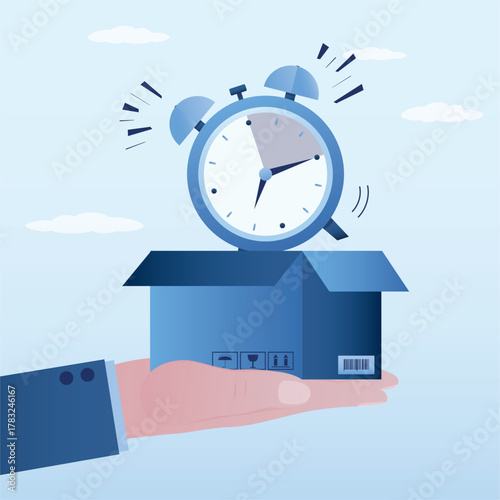 Businessman hand holding opened cardboard box with alarm clock. Deadline concept. Countdown, fast delivery, shipment. Ecommerce technology, delivery concept.
