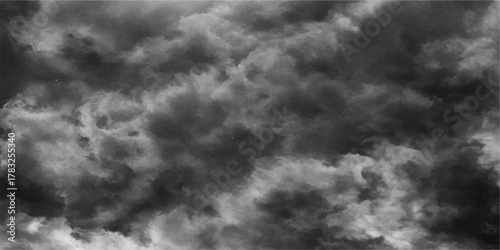 Dramatic smoke on black with dark stormy clouds in the summer sky