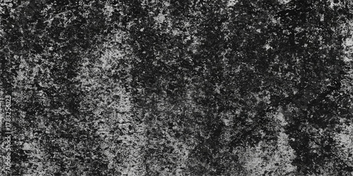 Closeup macro of a seamless black and white rough granite asphalt texture pattern surface for a concrete wall backdrop