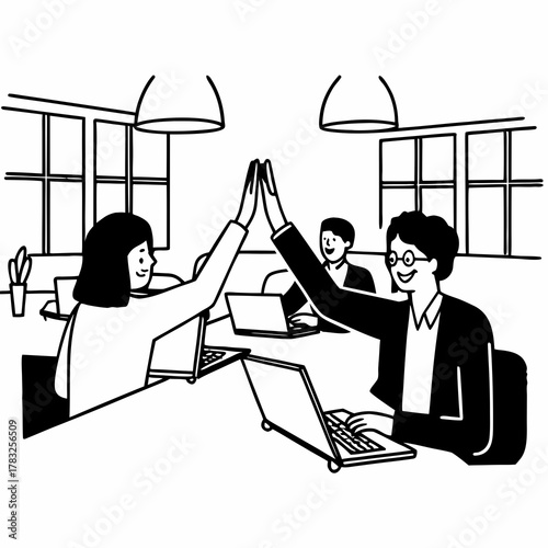 Successful business people giving each other a high five while working on laptop in coworking