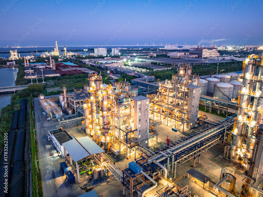 Fototapeta premium Aerial view of petrochemical plant at dusk