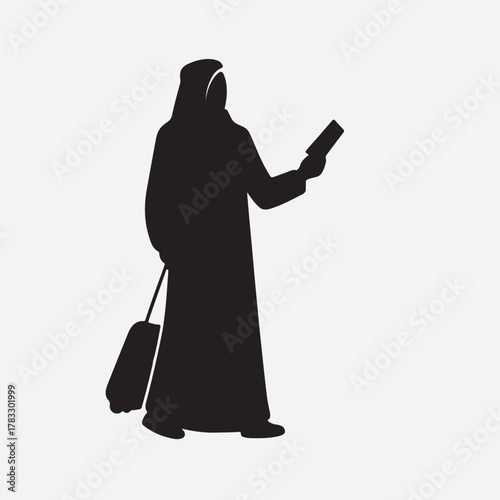 Arab woman with suitcase checking phone silhouette