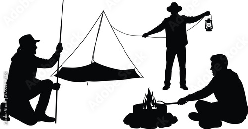 Silhouette of campers setting up camp with tent and campfire