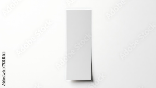A plain, vertical, rectangular, white paper element casting a shadow on a white background.