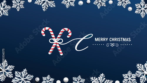 Festive merry christmas greeting card with crossed candy canes and snowflakes on a deep blue background
