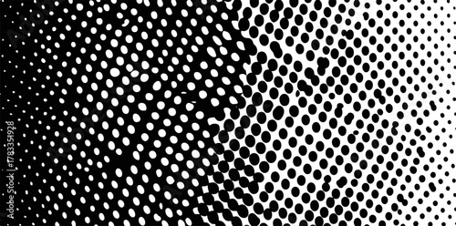 Un pattern astratto di punti neri su sfondo bianco crea un effetto di sfumatura dinamica