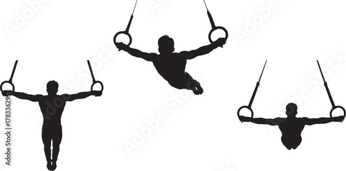 Male gymnast performing on gymnastic rings