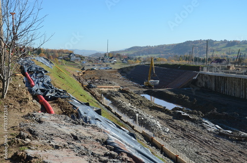 Fototapeta Naklejka Na Ścianę i Meble -  Construction of railway line No. 104 in the mountains – visible earthworks, slope reinforcements, and engineering structures under construction.