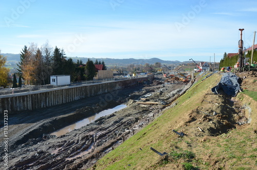 Fototapeta Naklejka Na Ścianę i Meble -  Installation of ground anchors on a mountain slope – slope stabilization and reinforcement works during railway line construction. Visible drilling rigs, steel anchors lk104.