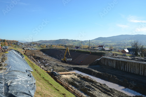Fototapeta Naklejka Na Ścianę i Meble -  Construction of railway line No. 104 in the mountains – visible earthworks, slope reinforcements, and engineering structures under construction.